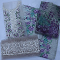 Embroidered fabric pieces with floral patterns on a white background
